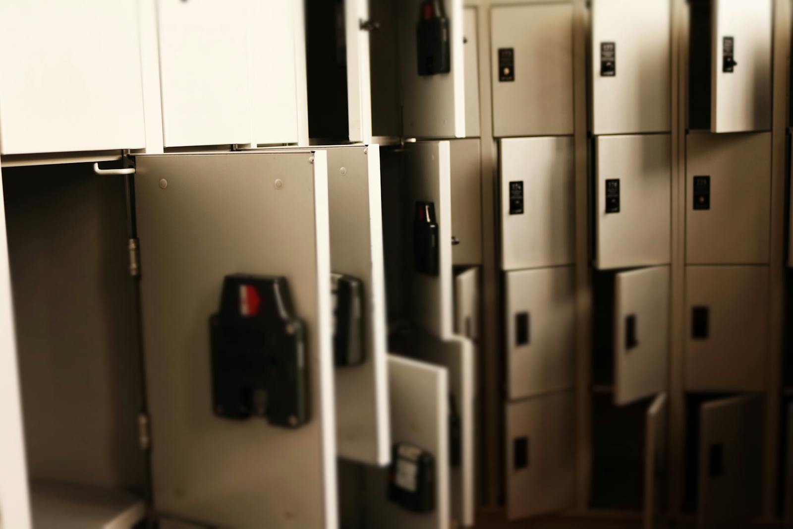 A row of open lockers in a secure indoor storage area, ideal for storing valuables.